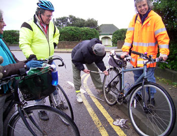 Mick's puncture outide 'Millionaires Row'