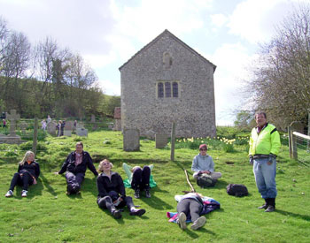 Sunbathing outside Coombes church 