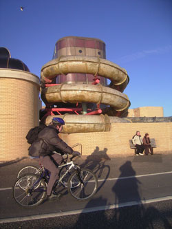 Neil and another cycle past the doomed King Alfred building 