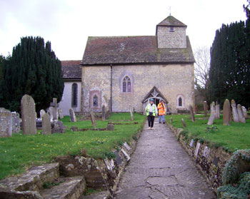 Two pilgrims leaving the church 