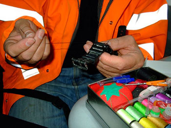 Jim catches up with some mending on the train 