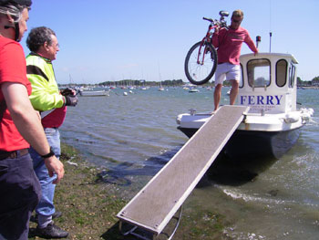 The ferryman brings down the bikes 